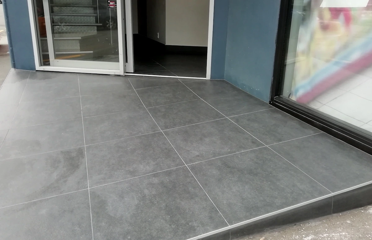 Commercial entry area with slip-resistant tiled floor in Johnsonville – tiled by Direct Tiling